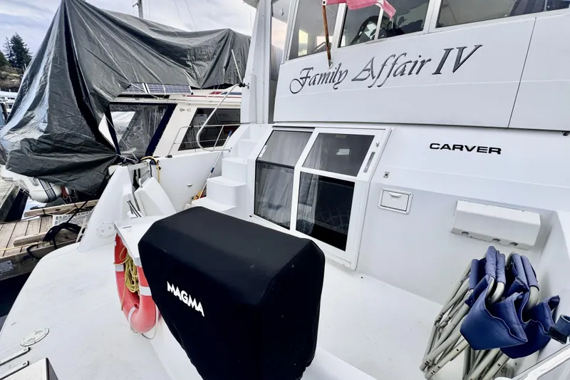 Family Affair IV Yacht Photos Pics 1997 Carver 500 Cockpit Motor Yacht docked, featuring "Family Affair IV" name on the stern.