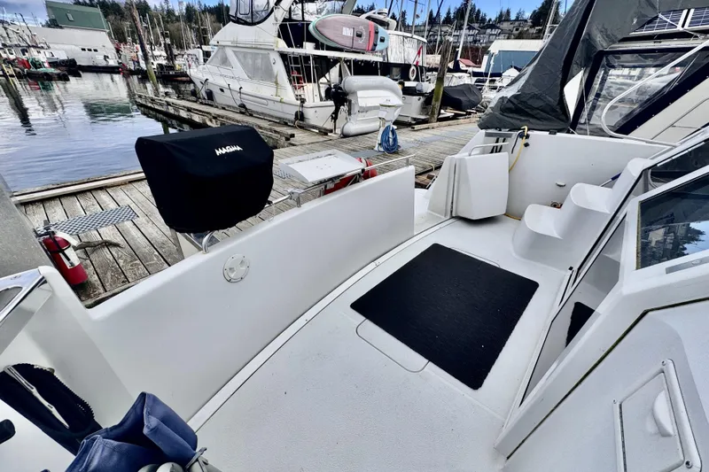 Family Affair IV Yacht Photos Pics 1997 Carver 500 Cockpit Motor Yacht docked, featuring spacious deck and marina view.