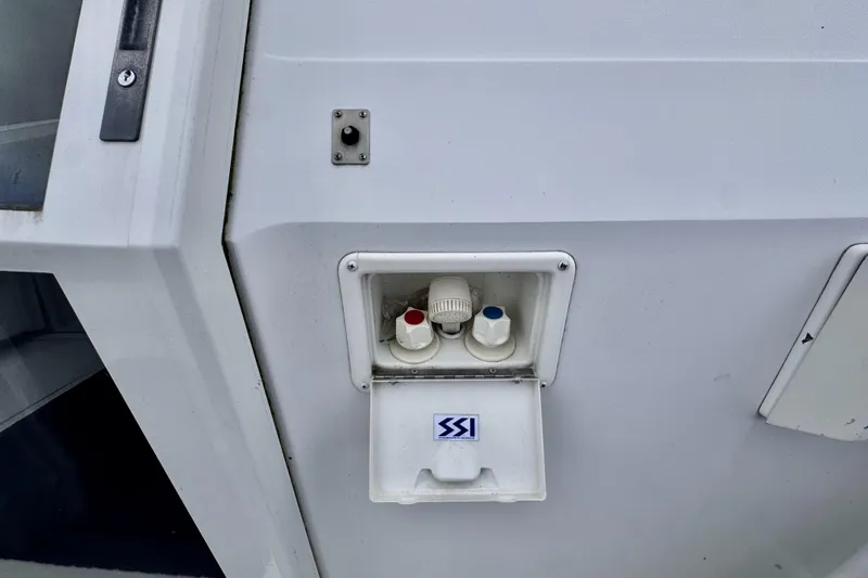 Family Affair IV Yacht Photos Pics Water connection panel on a 1997 Carver 500 Cockpit Motor Yacht.