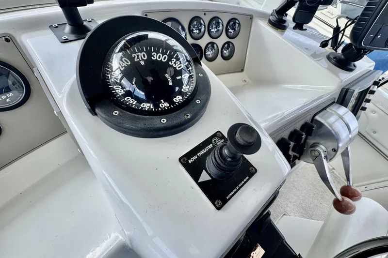 Family Affair IV Yacht Photos Pics 1997 Carver 500 Cockpit Motor Yacht helm with compass and controls.
