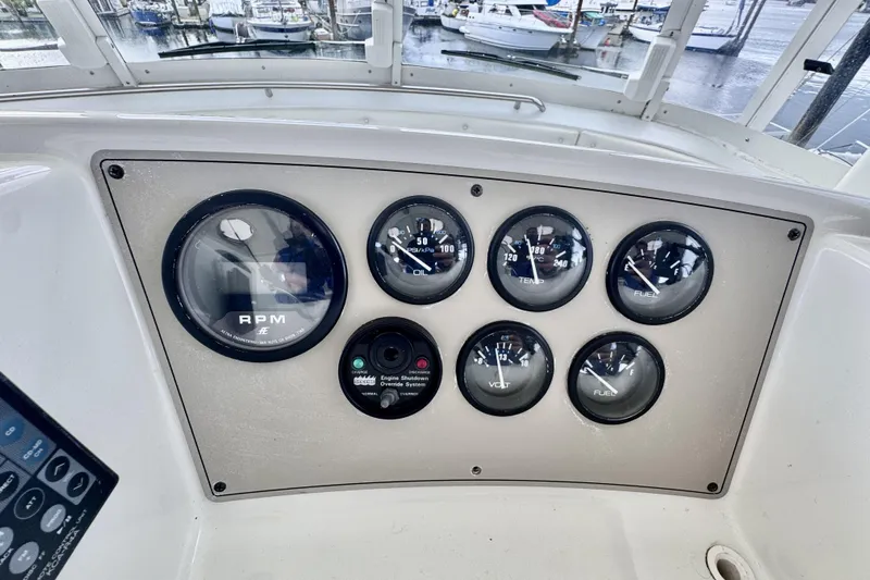 Family Affair IV Yacht Photos Pics Instrument panel of a 1997 Carver 500 Cockpit Motor Yacht with gauges and controls.
