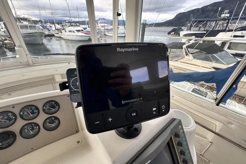 Family Affair IV Yacht Photos Pics Raymarine Dragonfly-7 display on 1997 Carver 500 Cockpit Motor Yacht dashboard, marina view.