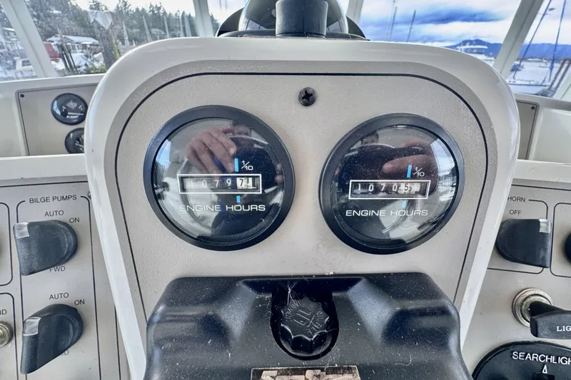 Family Affair IV Yacht Photos Pics Close-up of 1997 Carver 500 Cockpit Motor Yacht engine hour meters.