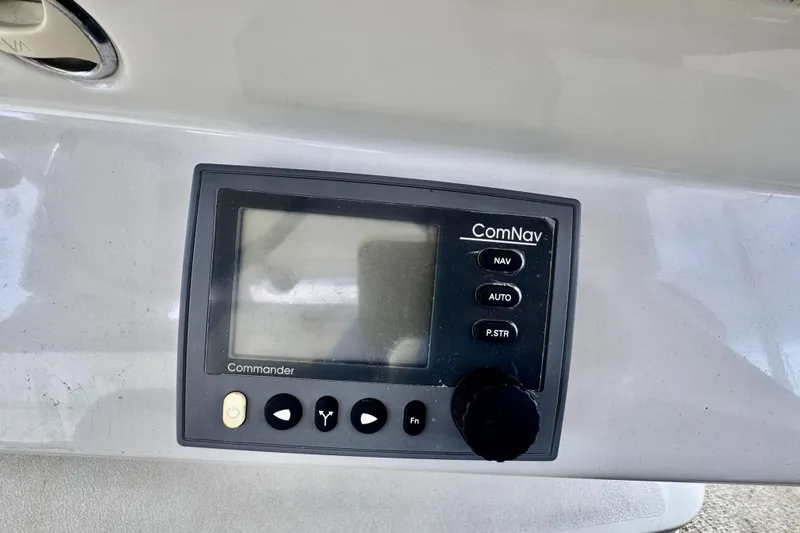 Family Affair IV Yacht Photos Pics ComNav Commander control panel on 1997 Carver 500 Cockpit Motor Yacht.