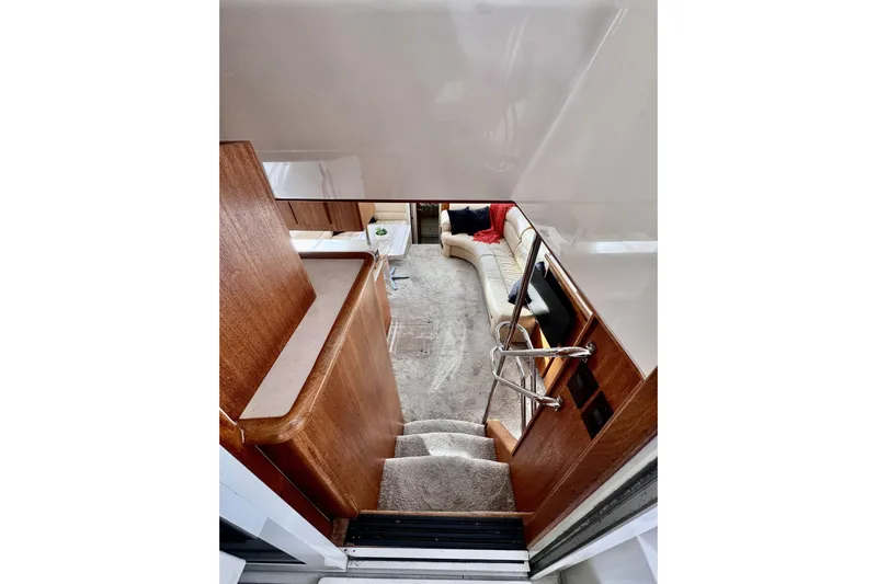 Family Affair IV Yacht Photos Pics Interior view of 1997 Carver 500 Cockpit Motor Yacht, featuring stairs and seating area.