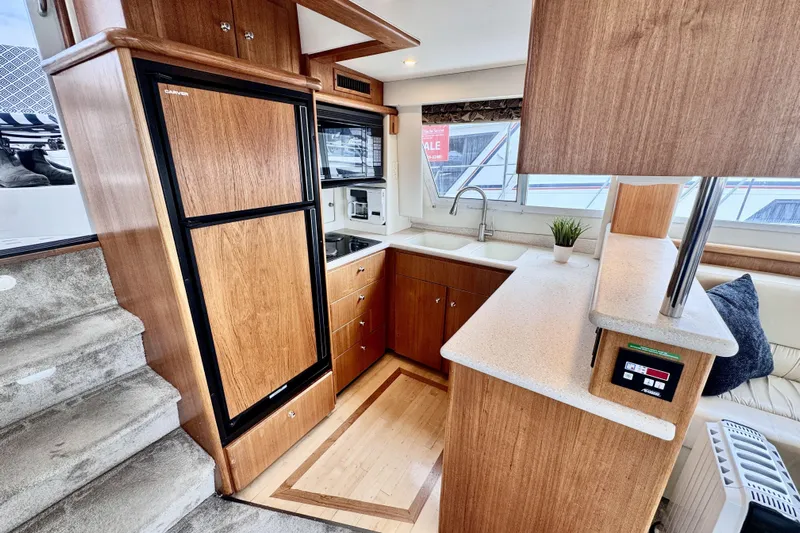 Family Affair IV Yacht Photos Pics Interior of 1997 Carver 500 Cockpit Motor Yacht with modern kitchen amenities.