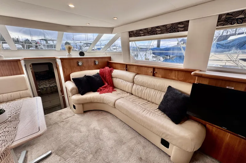 Family Affair IV Yacht Photos Pics Luxurious interior of 1997 Carver 500 Cockpit Motor Yacht with plush seating and elegant decor.