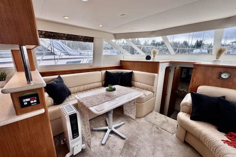 Family Affair IV Yacht Photos Pics Luxurious interior of a 1997 Carver 500 Cockpit Motor Yacht with plush seating and elegant decor.