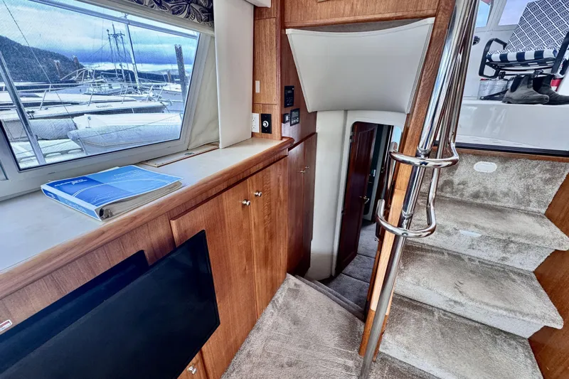 Family Affair IV Yacht Photos Pics Interior of 1997 Carver 500 Cockpit Motor Yacht with stairs and window view.