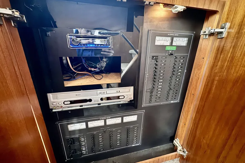 Family Affair IV Yacht Photos Pics Electrical control panel inside a 1997 Carver 500 Cockpit Motor Yacht.