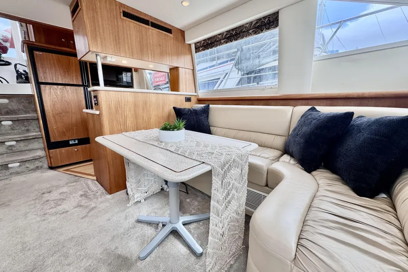 Family Affair IV Yacht Photos Pics Luxurious interior of 1997 Carver 500 Cockpit Motor Yacht with elegant seating and decor.