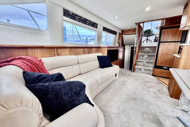 Family Affair IV Yacht Photos Pics Luxurious interior of 1997 Carver 500 Cockpit Motor Yacht with plush seating and elegant decor.