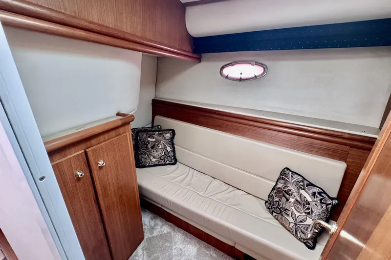 Family Affair IV Yacht Photos Pics Interior of 1997 Carver 500 Cockpit Motor Yacht with cushioned seating and decorative pillows.