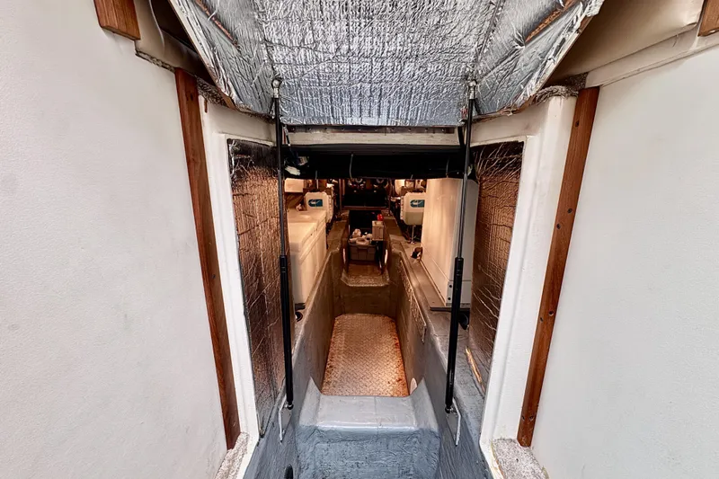 Family Affair IV Yacht Photos Pics Engine room of 1997 Carver 500 Cockpit Motor Yacht with insulation and equipment.