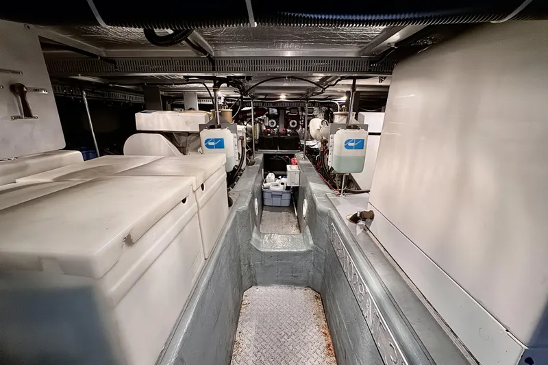 Family Affair IV Yacht Photos Pics Engine room of 1997 Carver 500 Cockpit Motor Yacht, showcasing equipment and storage.