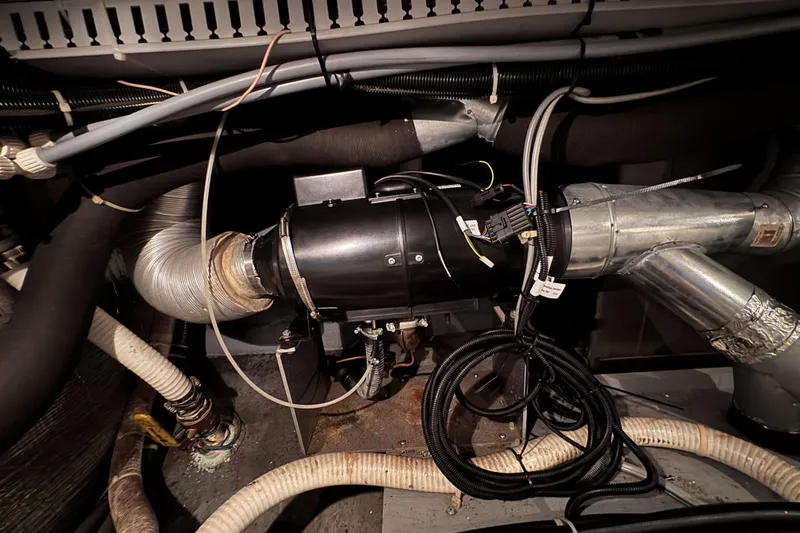 Family Affair IV Yacht Photos Pics Engine room of 1997 Carver 500 Cockpit Motor Yacht with visible wiring and ducts.