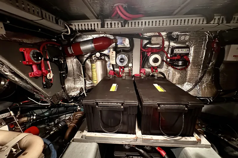 Family Affair IV Yacht Photos Pics Engine room of 1997 Carver 500 Cockpit Motor Yacht with batteries and equipment.