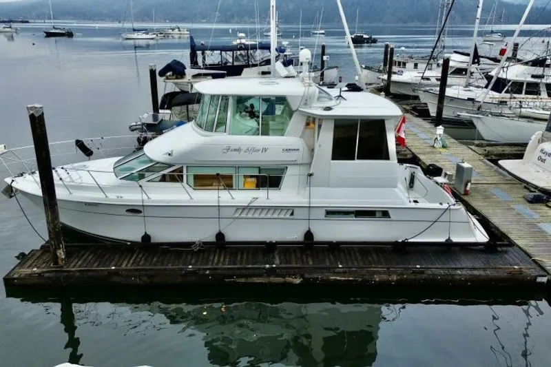 Family Affair IV Yacht Photos Pics 1997 Carver 500 Cockpit Motor Yacht docked at marina, side view.