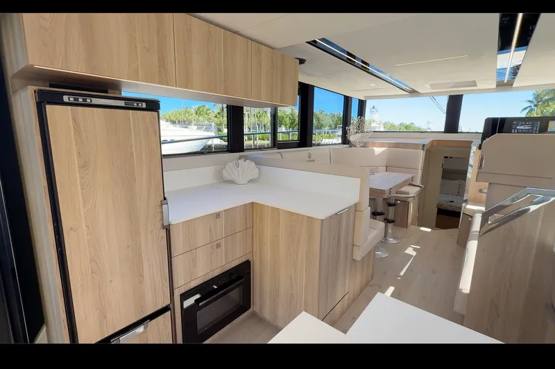  Yacht Photos Pics Luxurious interior of 2026 Cobra Yachts Seamaster 45 with modern kitchen and dining area.