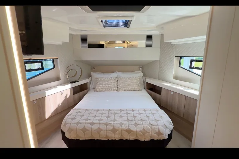  Yacht Photos Pics Luxurious bedroom interior of 2026 Cobra Yachts Seamaster 45 with modern design and natural light.