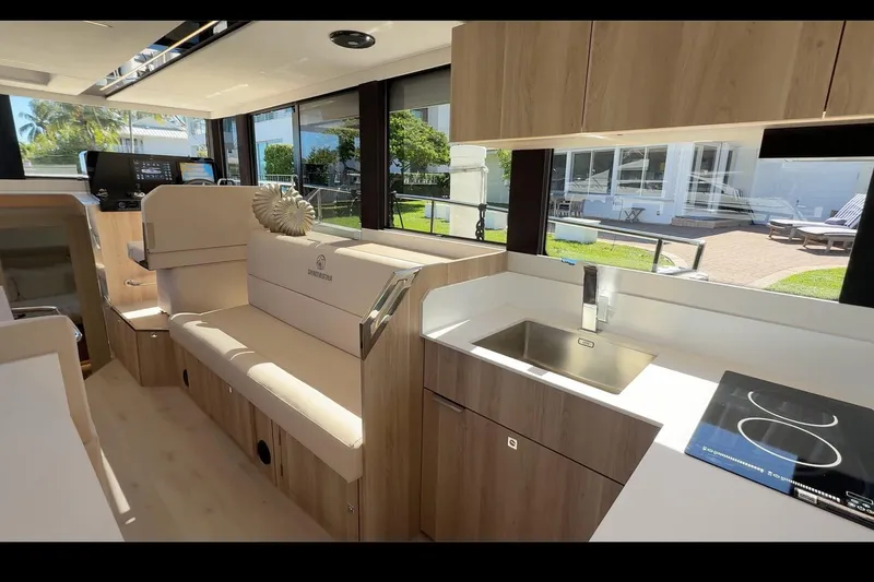  Yacht Photos Pics Modern interior of 2026 Cobra Yachts Seamaster 45, featuring sleek kitchen and seating area.