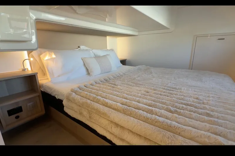  Yacht Photos Pics Luxurious bedroom interior of 2026 Cobra Yachts Seamaster 45 with plush bedding.