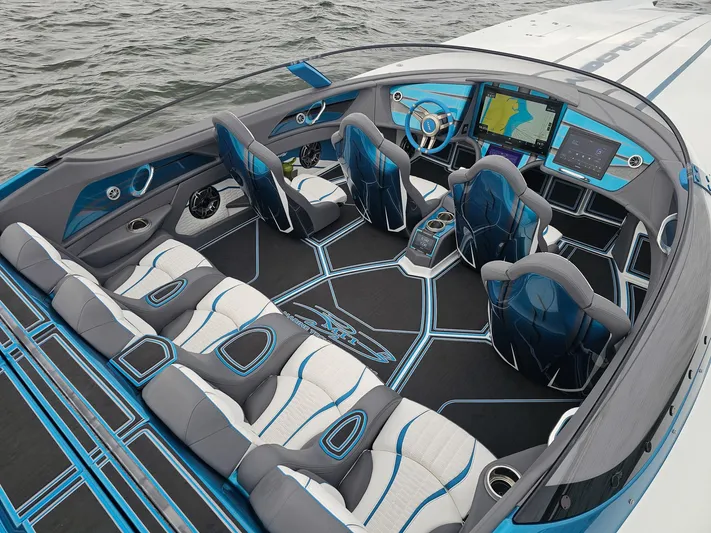  Yacht Photos Pics Interior of a 2026 MTI 440X speedboat with modern seating and advanced navigation systems.