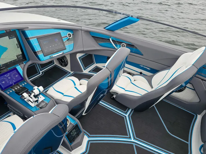  Yacht Photos Pics Interior of 2026 MTI 440X boat with modern blue and white seating and advanced navigation systems.