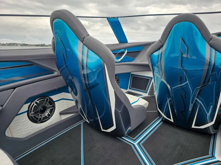  Yacht Photos Pics Interior of 2026 MTI 440X boat with sleek blue seats and modern design.