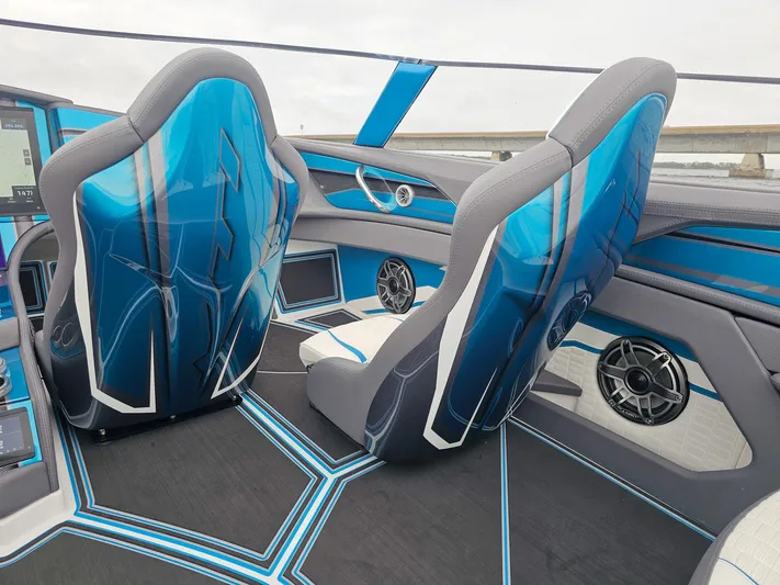  Yacht Photos Pics Interior of 2026 MTI 440X boat with blue and gray seats and modern design.