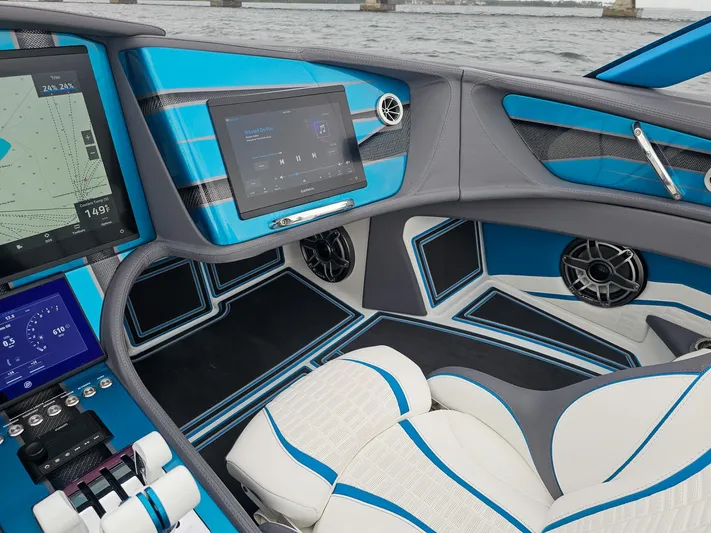  Yacht Photos Pics Interior of 2026 MTI 440X boat with modern blue and white design, featuring advanced navigation displays.