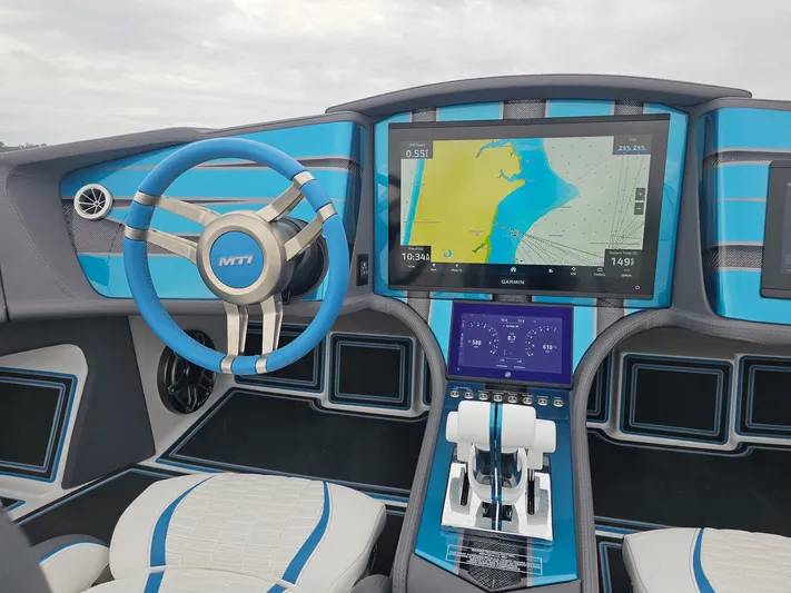  Yacht Photos Pics Interior of 2026 MTI 440X boat with advanced navigation system and blue accents.
