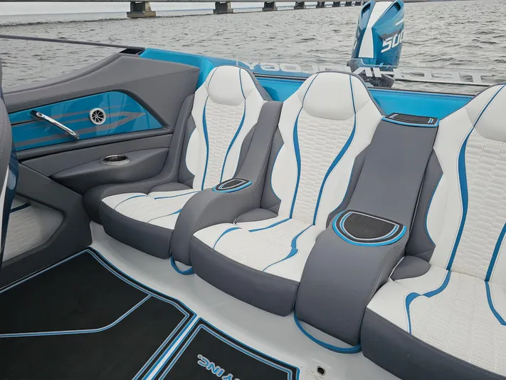  Yacht Photos Pics Luxury seating in 2026 MTI 440X boat, featuring sleek design and blue accents.