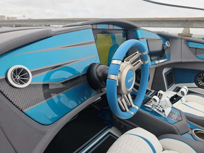  Yacht Photos Pics Futuristic MTI 440X 2026 boat interior with blue accents and advanced controls.