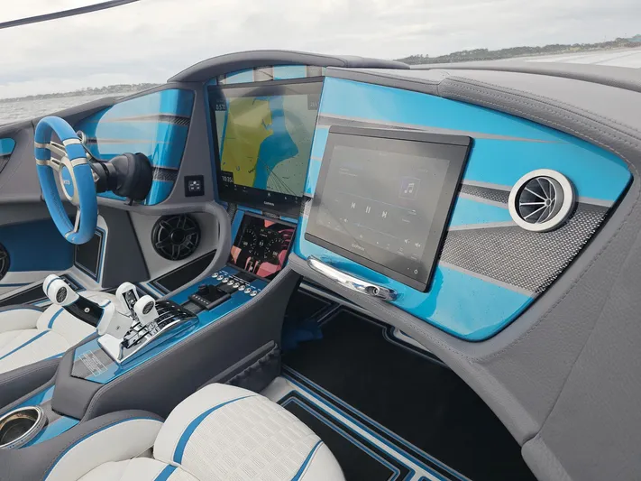 Yacht Photos Pics Interior of 2026 MTI 440X boat with blue accents and advanced navigation system.