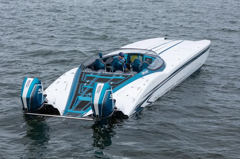  Yacht Photos Pics 2026 MTI 440X powerboat with dual engines on water, featuring sleek design and modern technology.