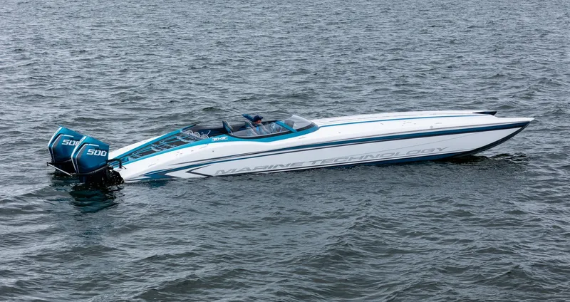  Yacht Photos Pics 2026 MTI 440X powerboat on water, featuring dual 500 engines.