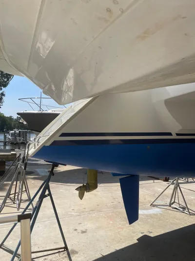 Wander Cat Yacht Photos Pics 2004 Lagoon 380 catamaran on stands, showcasing hull and keel in a boatyard.