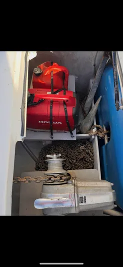 Wander Cat Yacht Photos Pics Storage compartment of a 2004 Lagoon 380 with anchor, chain, and Honda fuel tank.