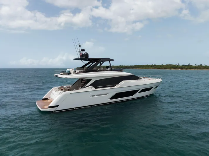 Calma Yacht Photos Pics 2023 Ferretti Yachts 720 cruising on open water under a partly cloudy sky.