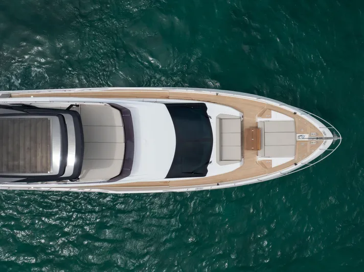 Calma Yacht Photos Pics Aerial view of 2023 Ferretti Yachts 720 on turquoise water.