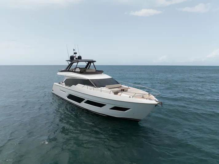 Calma Yacht Photos Pics 2023 Ferretti Yachts 720 cruising on open sea under clear sky.