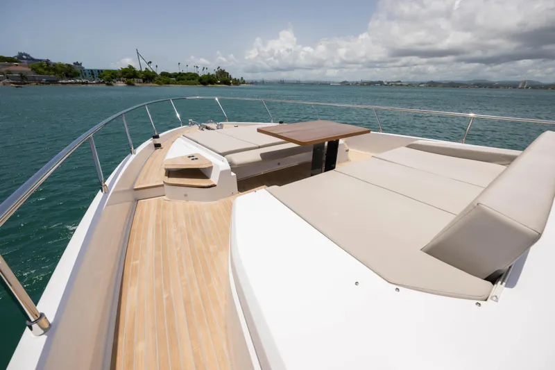 Calma Yacht Photos Pics Luxurious 2023 Ferretti Yachts 720 deck with sun loungers and ocean view.
