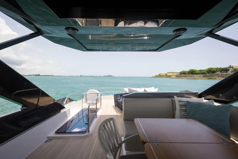 Calma Yacht Photos Pics Luxurious 2023 Ferretti Yachts 720 interior with ocean view and elegant seating area.