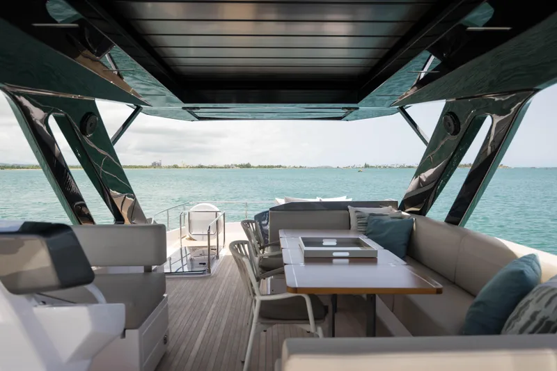 Calma Yacht Photos Pics Luxurious 2023 Ferretti Yachts 720 interior with ocean view and elegant seating area.