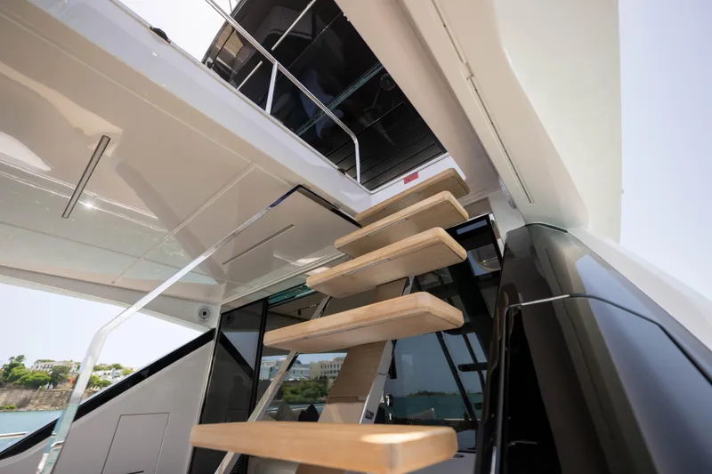 Calma Yacht Photos Pics Modern staircase on 2023 Ferretti Yachts 720, leading to upper deck.
