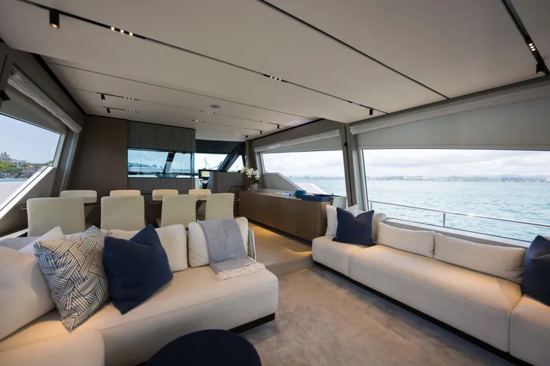 Calma Yacht Photos Pics Luxurious interior of 2023 Ferretti Yachts 720 with elegant seating and ocean view.