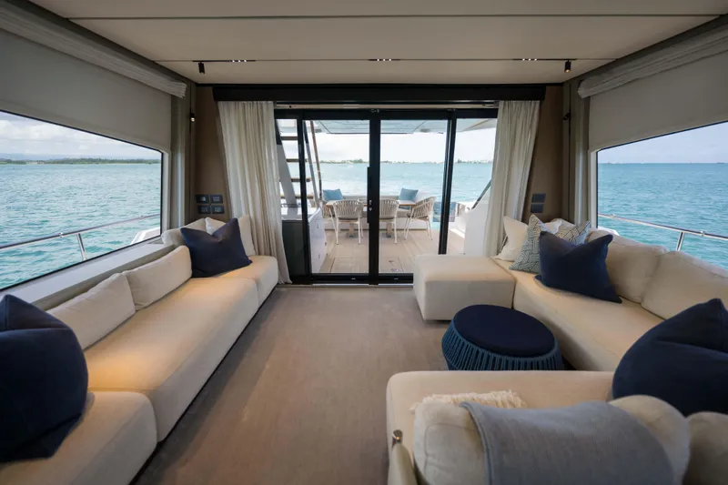 Calma Yacht Photos Pics Luxurious interior of 2023 Ferretti Yachts 720 with ocean view.