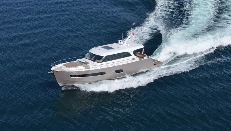  Yacht Photos Pics 2025 Altima Express Coupe 65 yacht cruising on open water.