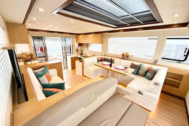  Yacht Photos Pics Luxurious interior of 2025 Altima Express Coupe 65 yacht with elegant seating and dining area.